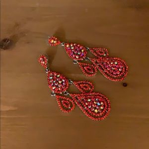 Red studded dangly earrings